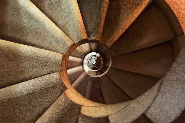 Photo of spiral staircase with black round hold